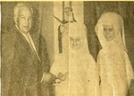 Newspaper clipping showing Sister Madonna receiving a donation