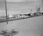 Photograph of Dante's Drive-In, Texaco, and Basic Auto Parts, Henderson