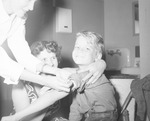 Photograph of a boy receiving the Polio vaccine, Henderson, April 1955