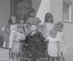Photograph of girls posing with dolls, Henderson, August 1955