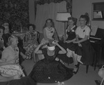 Photograph of women playing party game, Henderson, October 1955