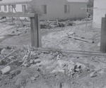 Photograph of a flood-damaged fence, Henderson, July 24, 1955