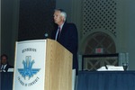 Photograph of Bill Hunt speaking at Henderson Chamber of Commerce installation, 2000