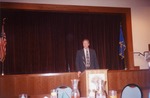 Photograph of Richard Perkins speaking at Desert Willow Gold Course event, 1998