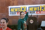 Photograph of Jessica Saly and Rachel Ross in front of a podium, Henderson, Nevada, December 1997
