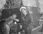 Photograph of fire chief W.D. Richard and a boy scout, Henderson, 1956