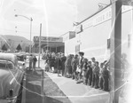 Photograph of people waiting in line at the Victory Theater, Henderson, December 1955