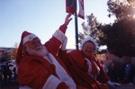 Photograph of Santa Clause and Mrs. Clause at the Henderson Christmas Parade, December 1997