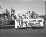 Photograph of the cast of "The Desert Flower Angel" float in the Industrial Days parade, Henderson, May 7, 1955