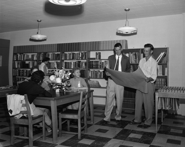 Photograph of people inside the Henderson District Public Library, Henderson, October 1956