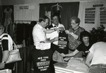 Photograph of Senator Richard Bryan admires the Henderson Chamber of Commerce T-shirt, 1991