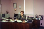 Photograph of Henderson Chamber of Commerce Executive Director, Alice J. Martz in her office, February 1998