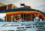 Photograph of a parade float advertising Mayor Robert Groesbeck and Councilman Andy Hafen, 1996