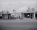Photograph of businesses on Water Street, Henderson, 1957