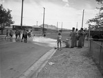 Photograph of children playing at fire hydrant, Henderson, July 1961