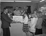Photograph of carnival ride tickets being sold, Henderson, March 1965