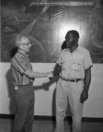 Photograph of Huey James receiving a 10 years of service award, Henderson, August 1961