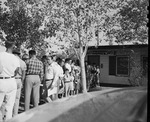 Photograph of potential homebuyers stand in line, Henderson, 1951