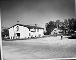 Photograph of people outside of St. Peter's Catholic Church, Henderson, 1956