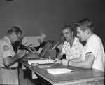 Photograph of people issuing drivers' licenses, Henderson, August 23, 1961