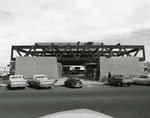 Photograph of a man entering the construction site of the Bank of Nevada, Henderson, January 7, 1974