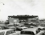Photograph of cars parked in front the Bank of Nevada construction site, Henderson, December 31, 1974