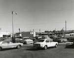 Photograph of the construction site for Bank of Nevada filled with parked cars, Henderson, October 27, 1973
